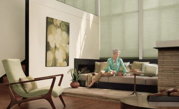 Adult woman in modern living room is reading book